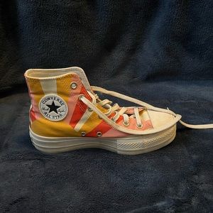 These are seasonal high top platform converse. Size 7.5, canvas material, bright